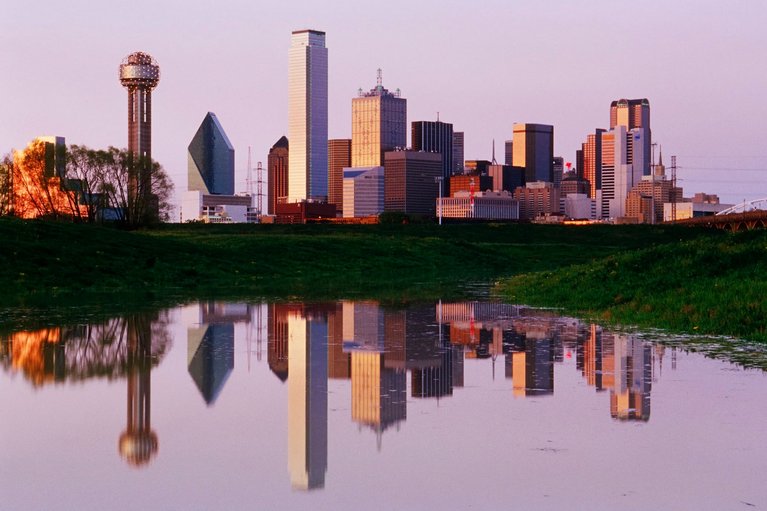 Dallas-Fort Worth skyline at dusk reflected in water