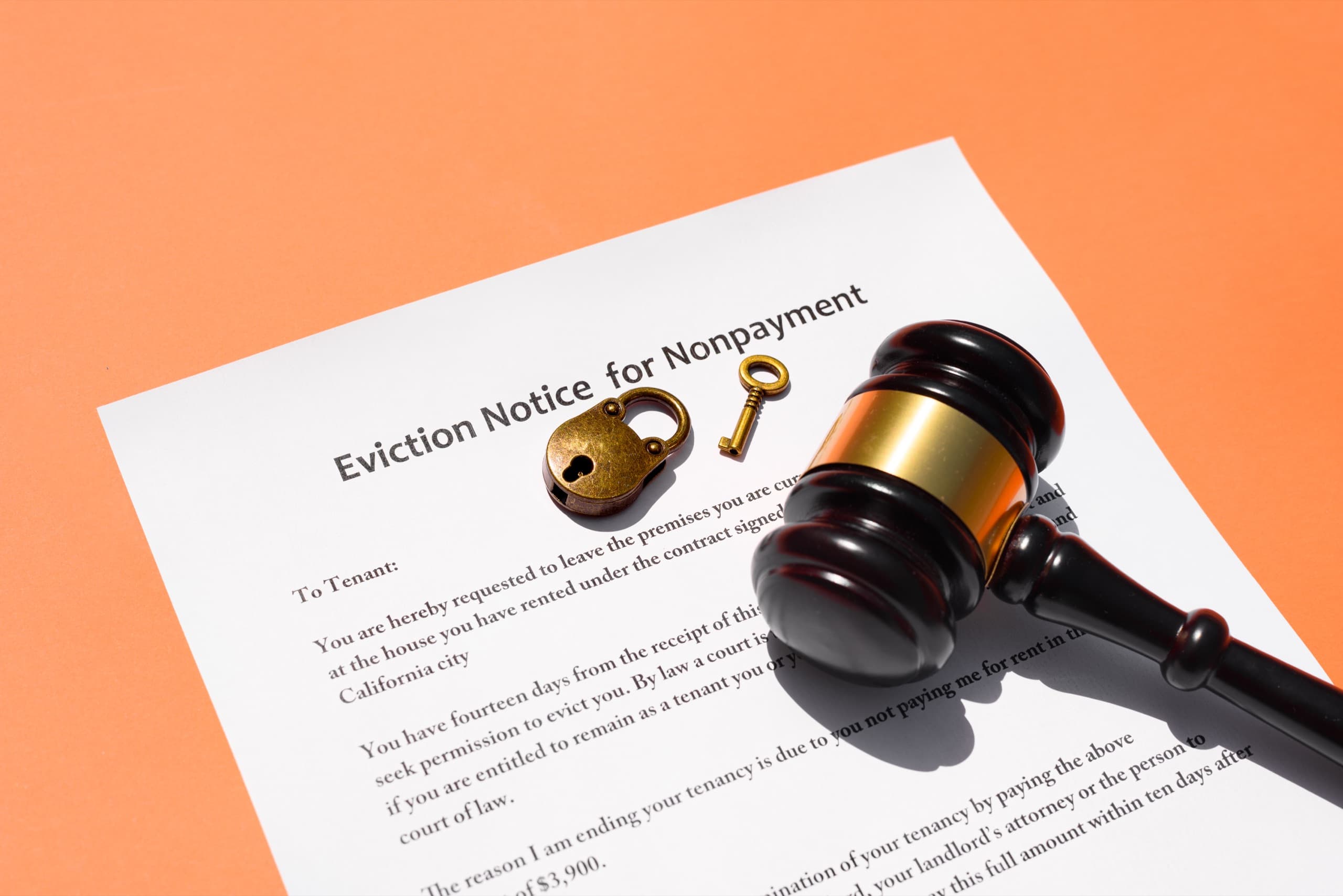 Eviction notice document on orange background