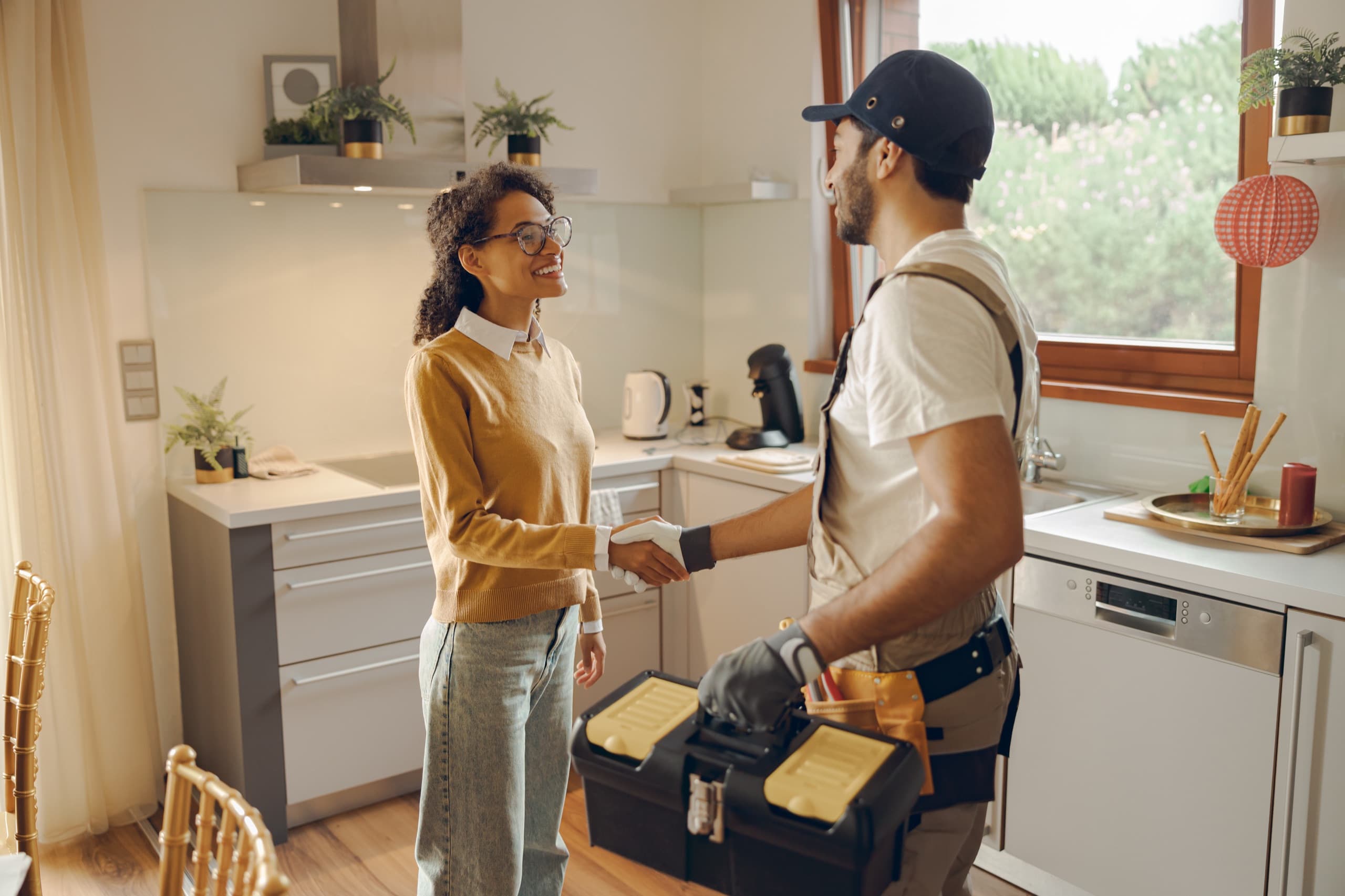 Contractor shaking hands with property manager